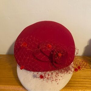 Betmar Elegant Crimson Fascinator Hat with Veil and Floral Design